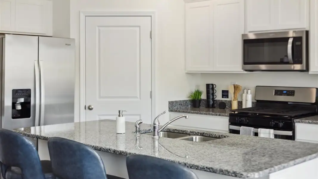 Furnished interior in a model home at Price's Point in Knoxville (Image 16).