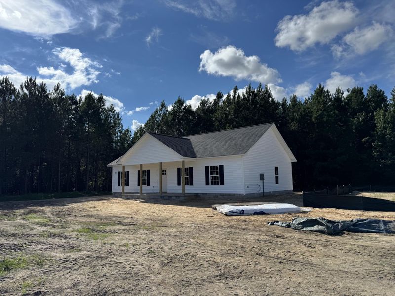 Front exterior of a new home in , St. George, SC, highlighting curb appeal (Image 1).