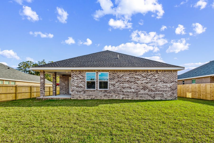 Representative exterior photo of a completed home built from the The Carlos by Herbst Homes in Doyle Hawkins Landing, Navarre, FL (Image 35).