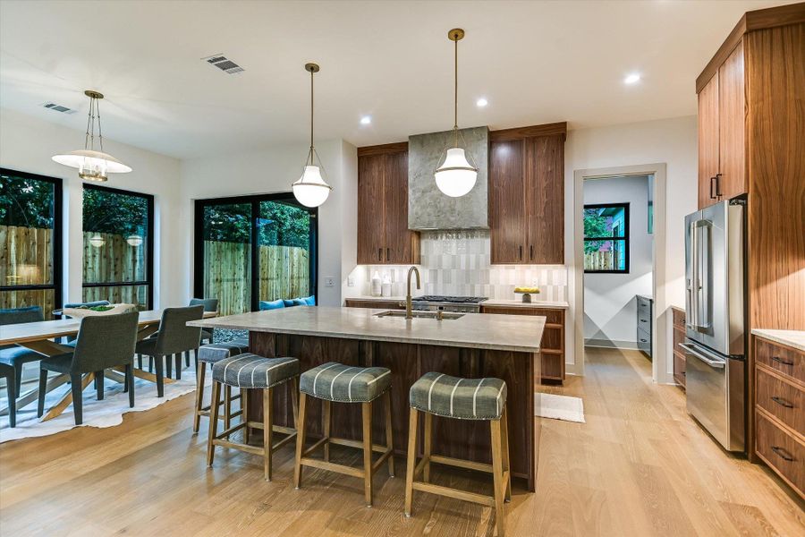 Culinary excellence awaits in this perfect kitchen, featuring a spacious island and chef quality stainless steel appliances. Culinary excellence awaits in this perfect kitchen, featuring a spacious island and chef quality stainless steel appliances.
