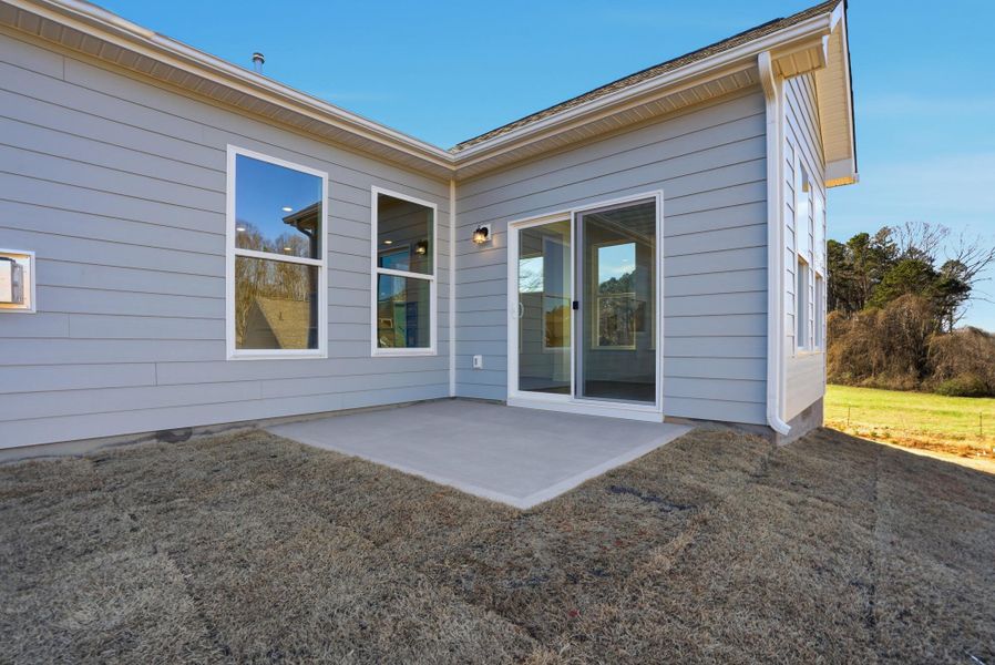 Exterior details and patio area of a home in Villas at Prestwick, Mooresville (Image 29).