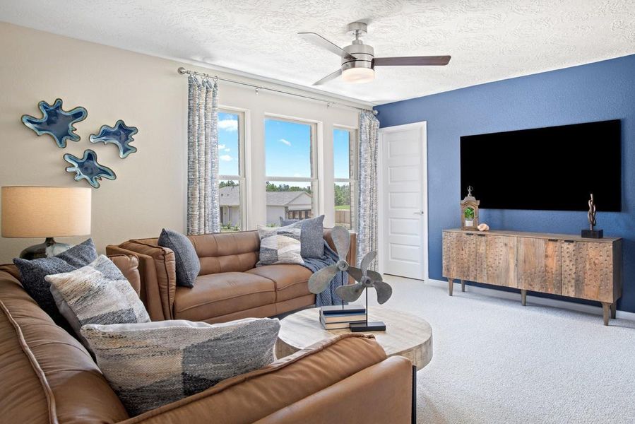 Perfect for entertaining is this amazing loft! Right upstairs, this space would be a fabulous teen hangout, media room, or adult game room! Featuring plush carpet, high ceilings with ceiling fan, custom paint and large windows!