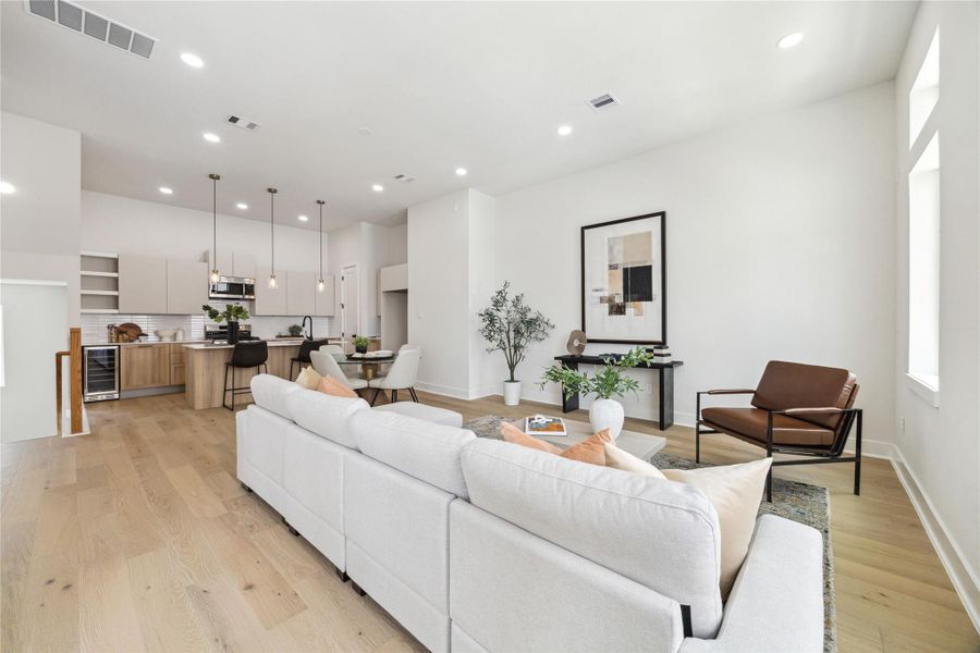 This spacious living area features modern design, abundant natural light, and seamless flow into the open kitchen—perfect for entertaining and relaxation.