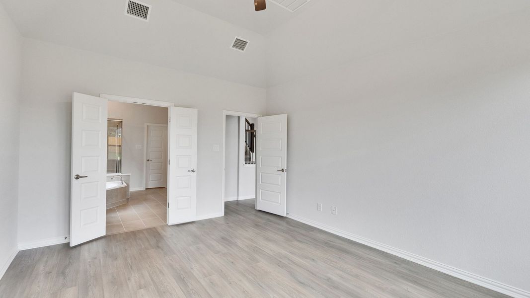 Furnished interior view inside a new home in Oaks at San Gabriel, Georgetown (Image 21).