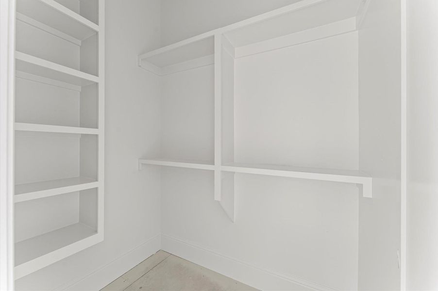 Walk-in closet for secondary bedroom. Photo taken in mid-November.