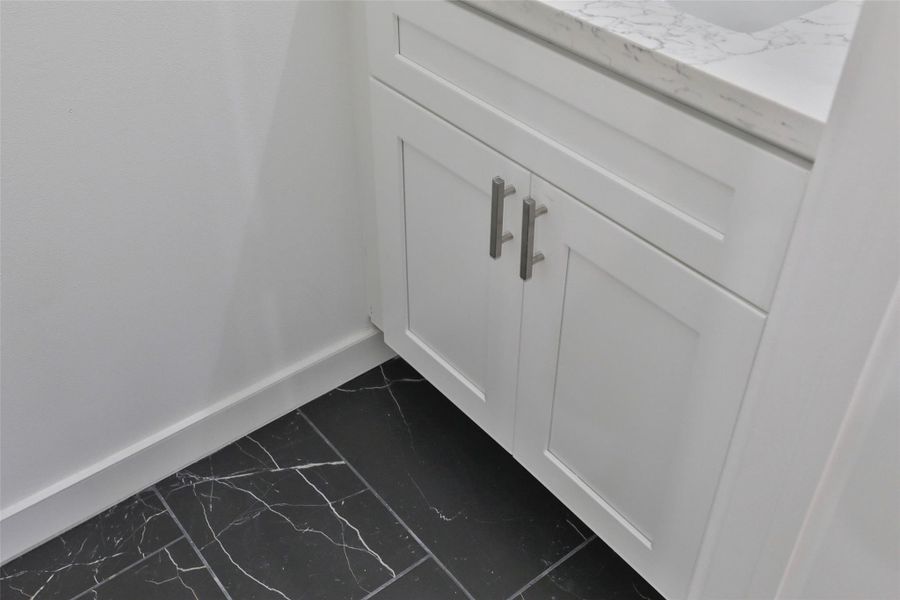 Elegant flooring enhances the powder bath.