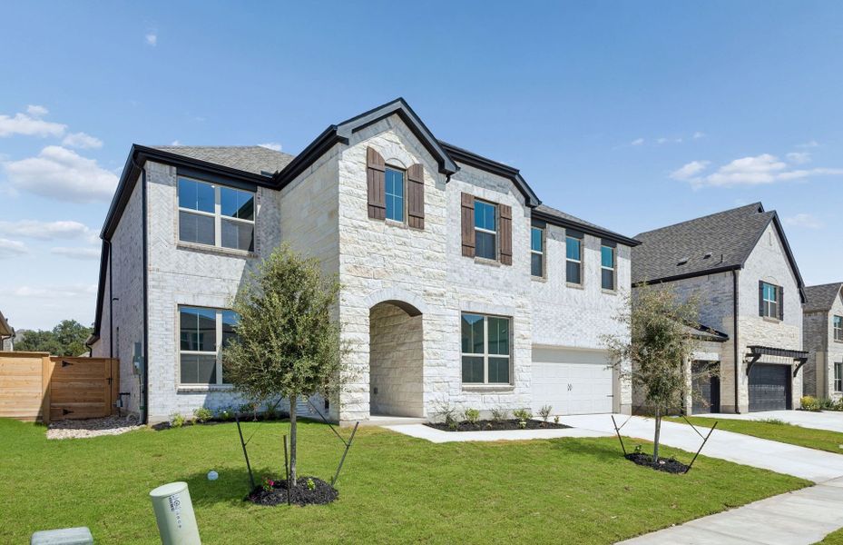 Front exterior of a new home in Bluffview Reserve, Leander, TX, highlighting curb appeal (Image 26).
