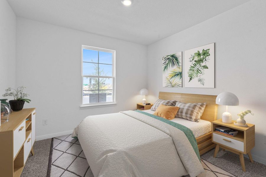 Bedroom featuring baseboards and carpet flooring Bedroom featuring baseboards and carpet flooring