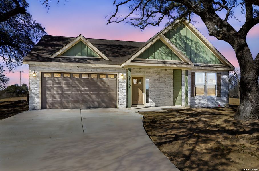 Front exterior of a new home in Lonesome Dove, San Antonio, TX, highlighting curb appeal (Image 23).