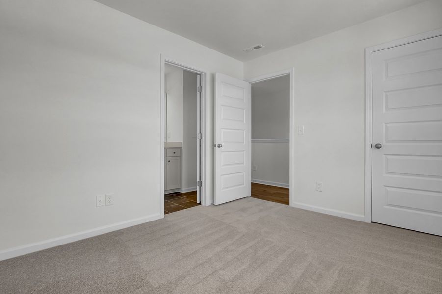 Spacious, unfurnished interior of a new home in Grand Park, Leland (Image 26). Spacious, unfurnished interior of a new home in Grand Park, Leland (Image 26).
