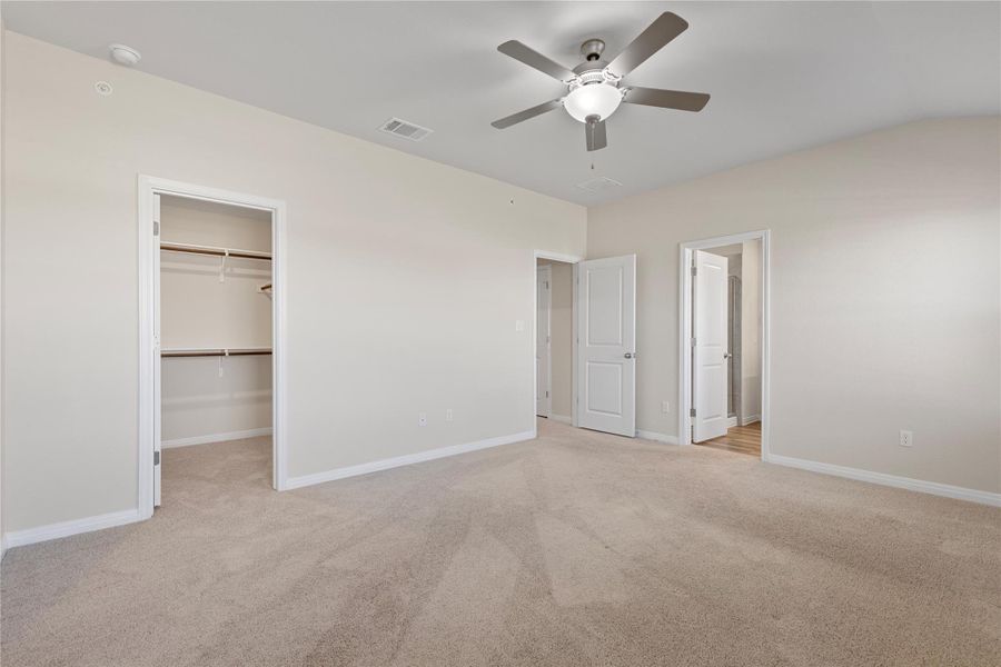 Master Bedroom alt view carpet, ceiling fan, walk in closet and connected bathroom Master Bedroom alt view carpet, ceiling fan, walk in closet and connected bathroom