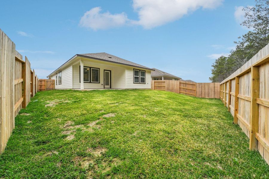 Exterior details and patio area of a home in Landing Meadows - Traditional Series, New Caney (Image 4).