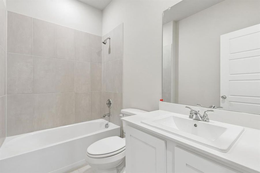 Bathroom in the Winters home plan by Trophy Signature Homes – REPRESENTATIVE PHOTO
