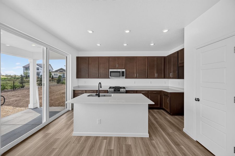 Furnished interior view inside a new home in The Aurora Highlands, Aurora (Image 3).