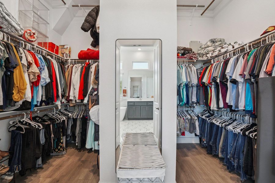Expansive walk-in closet with abundant shelving and ample hanging space to keep everything organized and within easy reach.