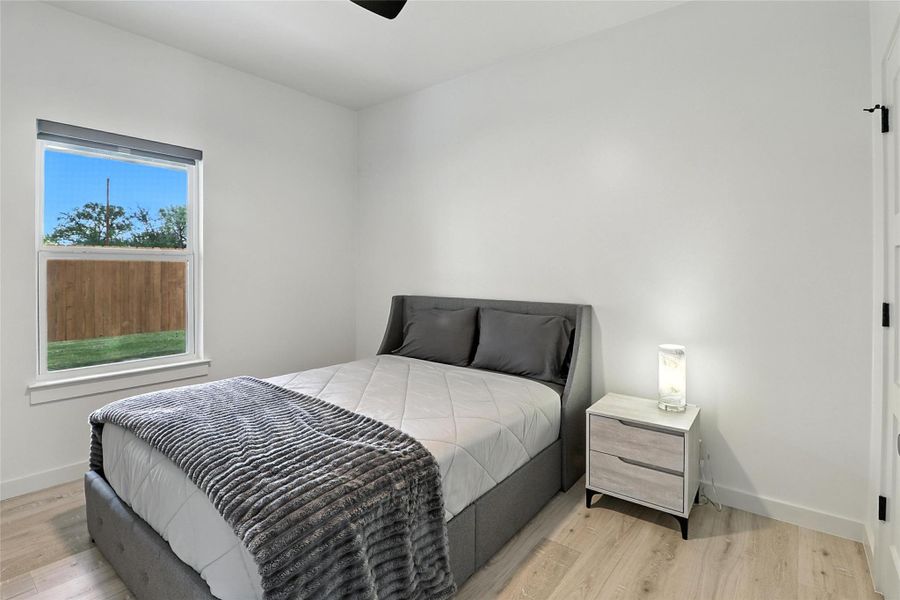 Bedroom featuring light wood finished floors and ceiling fan