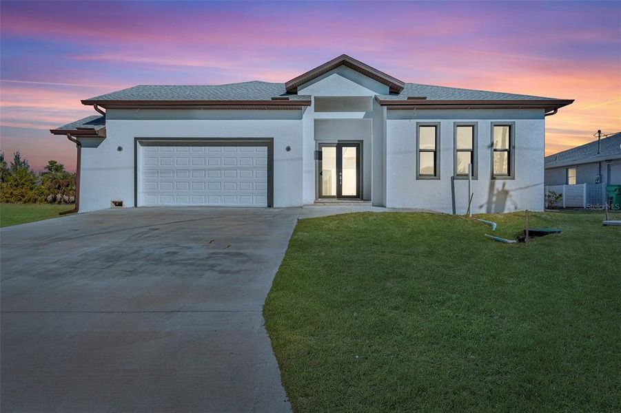 Front exterior of a new home in , Port Charlotte, FL, highlighting curb appeal (Image 14).