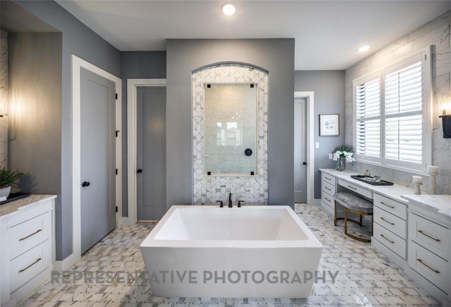 Full bath featuring a freestanding tub, a shower, and recessed lighting