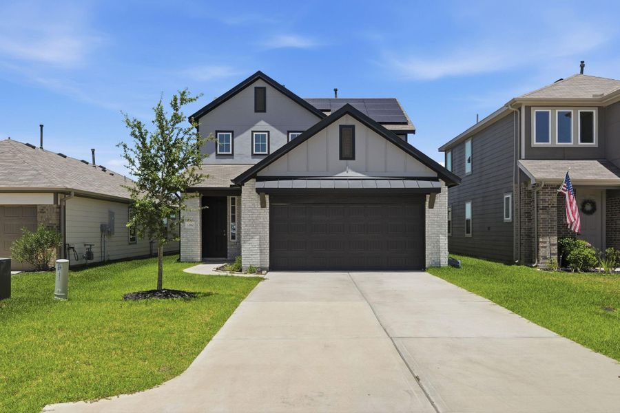 Front exterior of a new home in Mostyn Springs, Magnolia, TX, highlighting curb appeal (Image 2). Front exterior of a new home in Mostyn Springs, Magnolia, TX, highlighting curb appeal (Image 2).