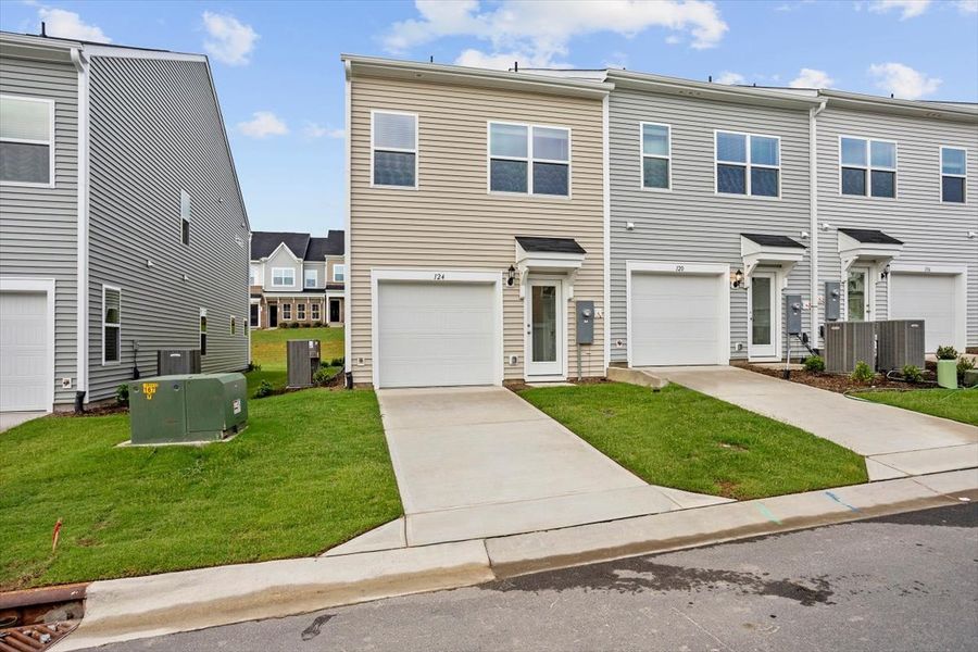 Front exterior of a new home in Renaissance at White Oak, Garner, NC, highlighting curb appeal (Image 22).