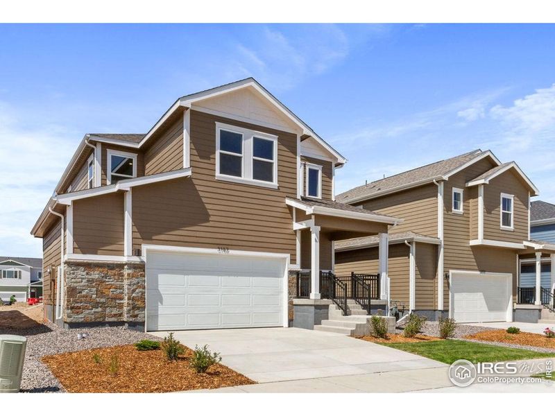 Front exterior of a new home in , Fort Collins, CO, highlighting curb appeal (Image 2).