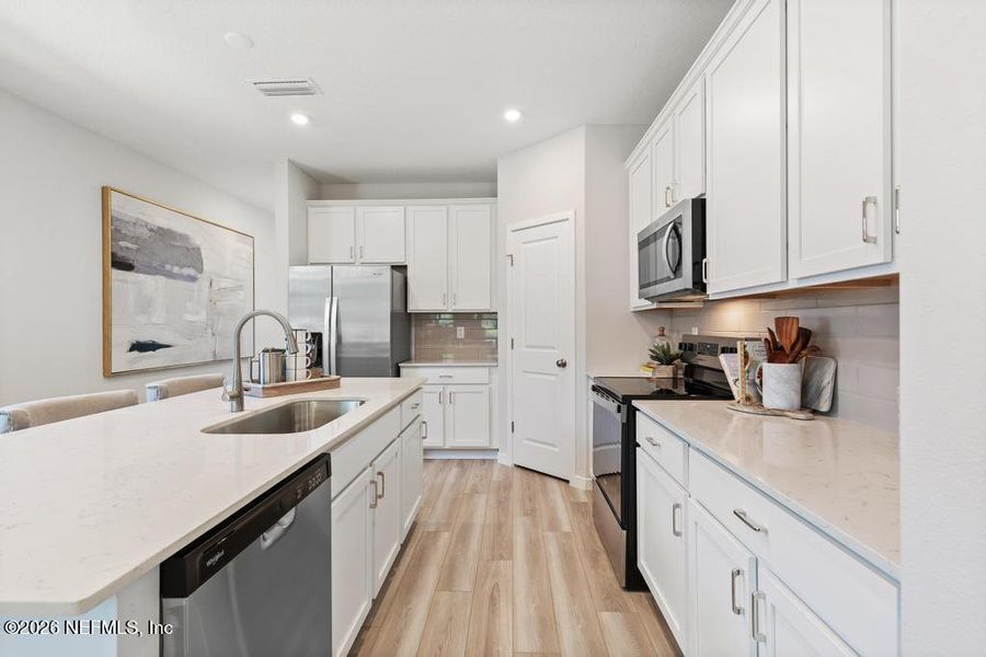 Furnished interior view inside a new home in Seminole Palms, Palm Coast (Image 5). Furnished interior view inside a new home in Seminole Palms, Palm Coast (Image 5).