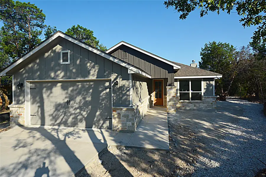 Front exterior of a new home in , Canyon Lake, TX, highlighting curb appeal (Image 1). Front exterior of a new home in , Canyon Lake, TX, highlighting curb appeal (Image 1).