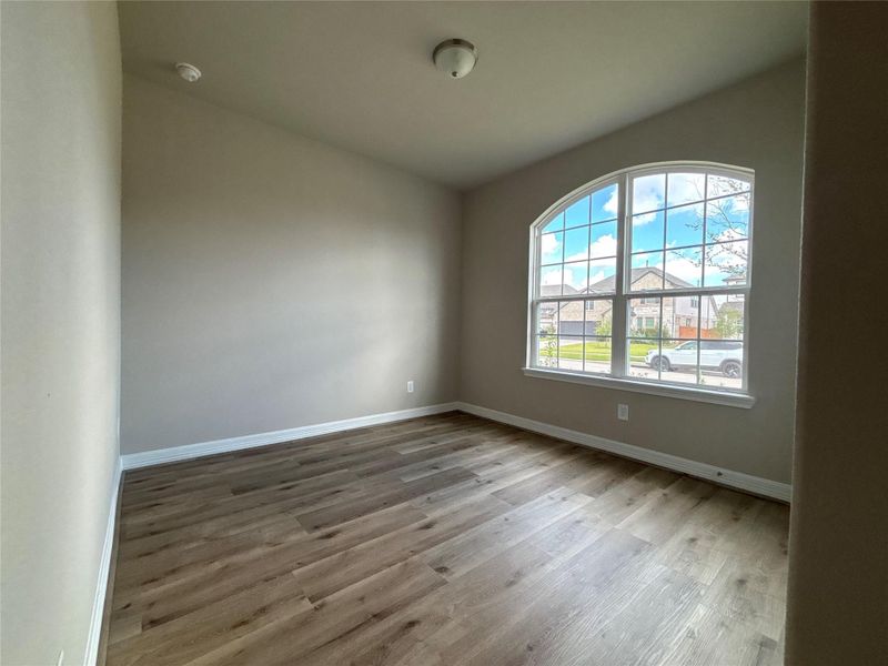 Spacious, unfurnished interior of a new home in Sunterra, Katy (Image 33).
