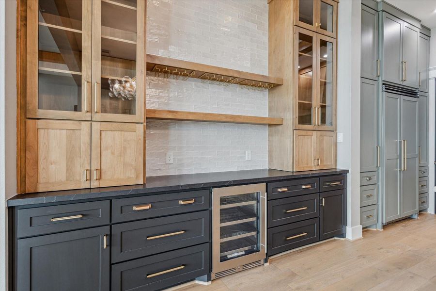 Custom cabinetry with plenty of storage and designer finishes.