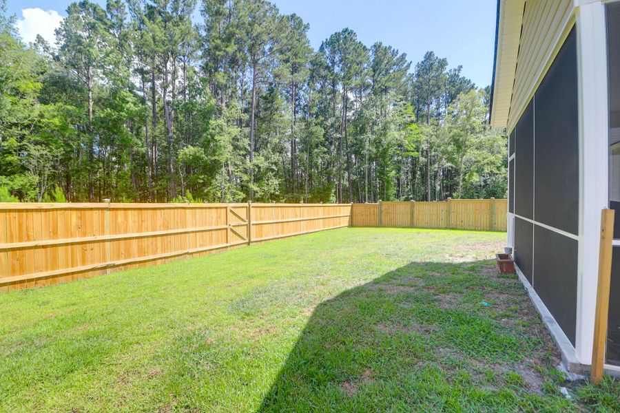 Exterior details and patio area of a home in Sweetgrass at Summers Corner: Arbor Collection, Summerville (Image 26).