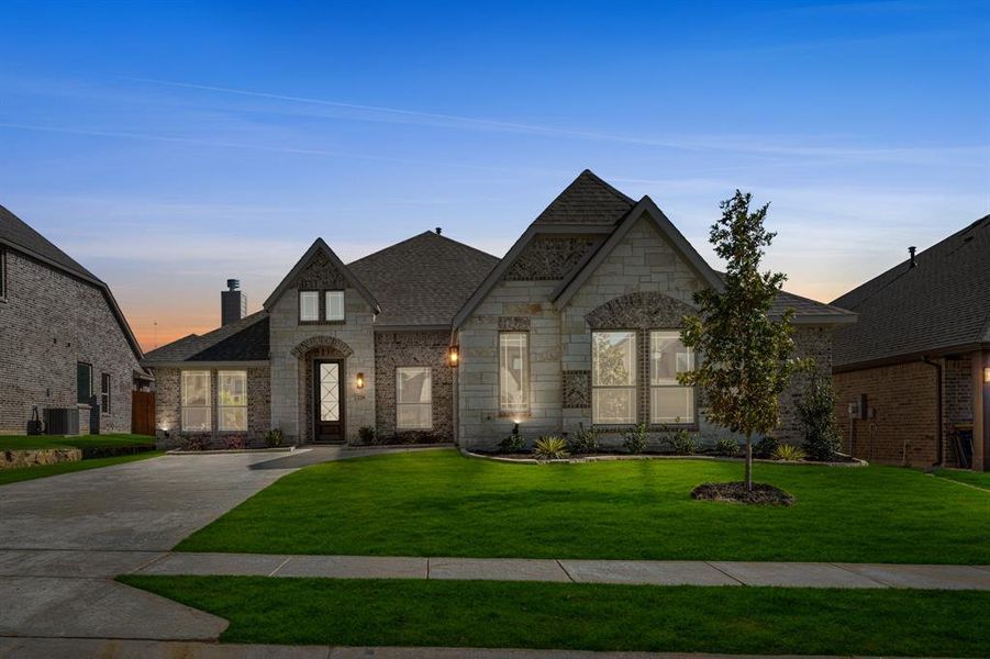 Front exterior of a new home in Sunset Ridge, Alvarado, TX, highlighting curb appeal (Image 1).