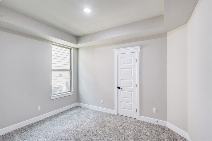 Unfurnished room featuring baseboards and carpet floors