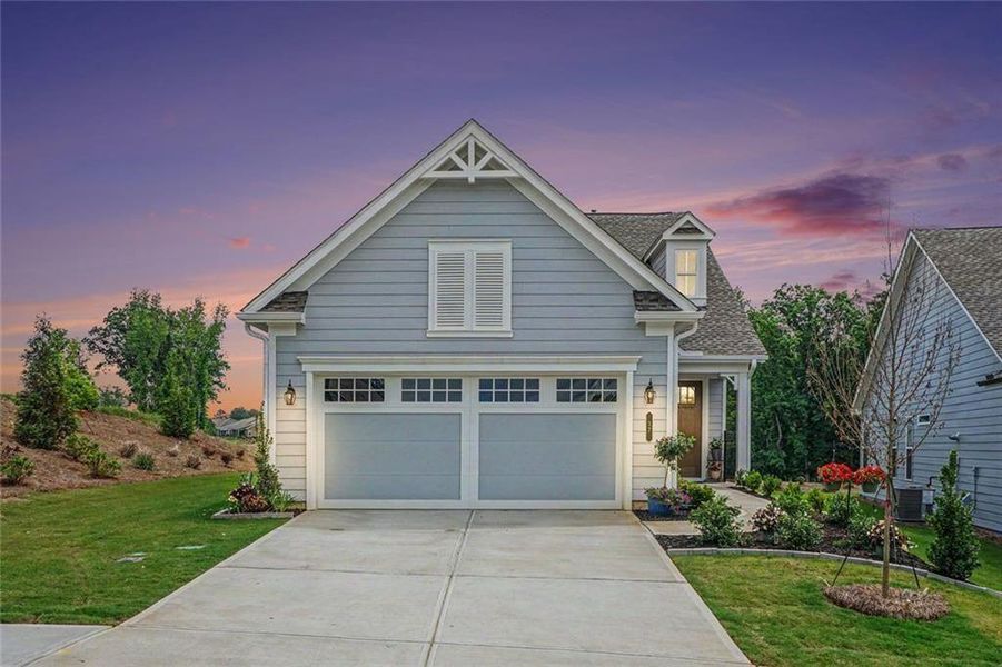 Front exterior of a new home in , Hoschton, GA, highlighting curb appeal (Image 24).