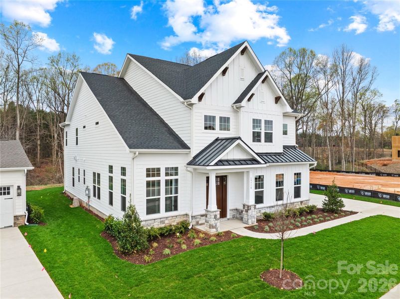 Front exterior of a new home in Coventry Glen, Huntersville, NC, highlighting curb appeal (Image 24).
