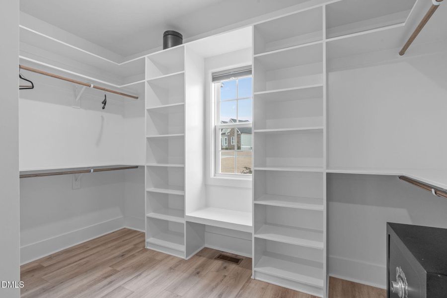 Primary Walk-In Closet Primary Walk-In Closet