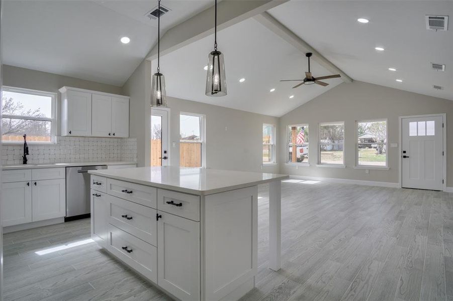 Kitchen featuring a sink, visible vents, and dishwasher