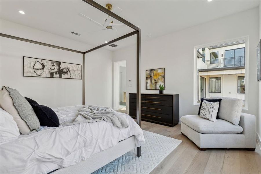 Bedroom with light hardwood / wood-style floors