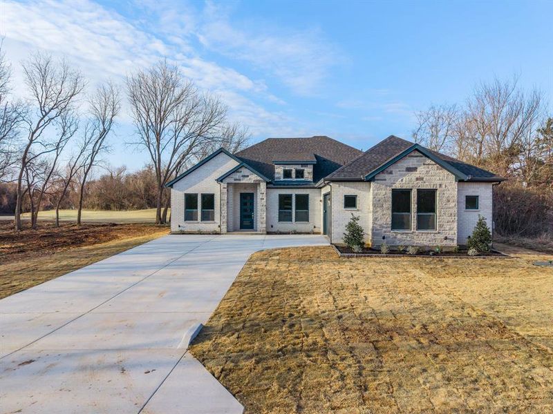 Front exterior of a new home in , Whitney, TX, highlighting curb appeal (Image 23).