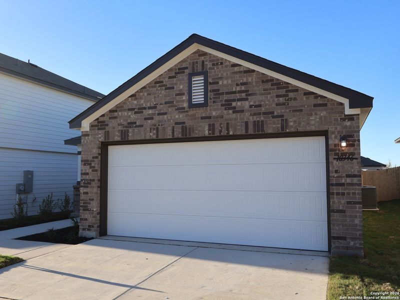 Front exterior of a new home in Paloma Park, Converse, TX, highlighting curb appeal (Image 17).
