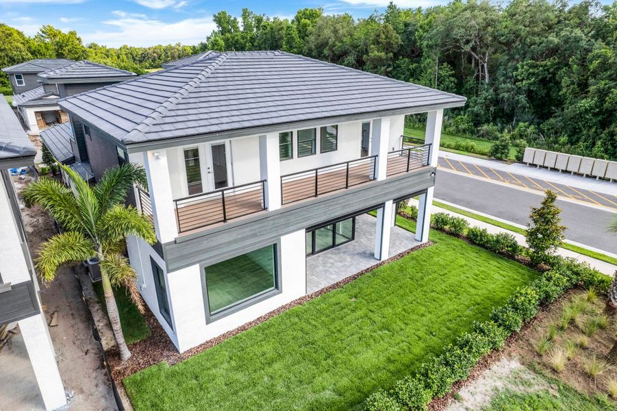 Exterior details and patio area of a home in Hampton Green at Providence, Davenport (Image 14).