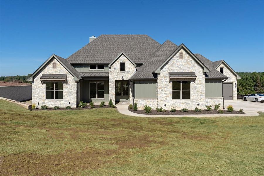 Front exterior of a new home in , Longview, TX, highlighting curb appeal (Image 2).