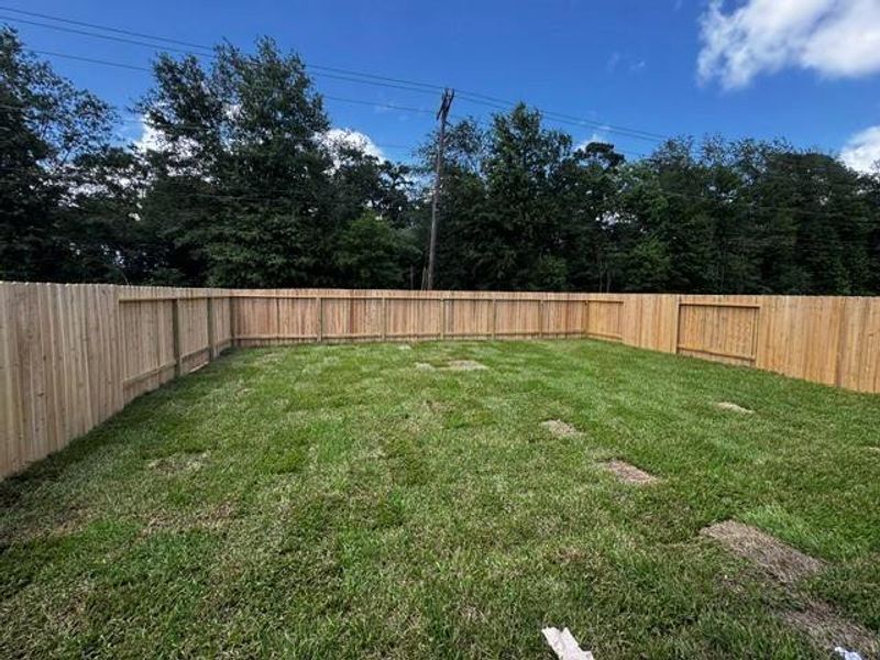 Exterior details and patio area of a home in Townsend Reserve, Splendora (Image 3).