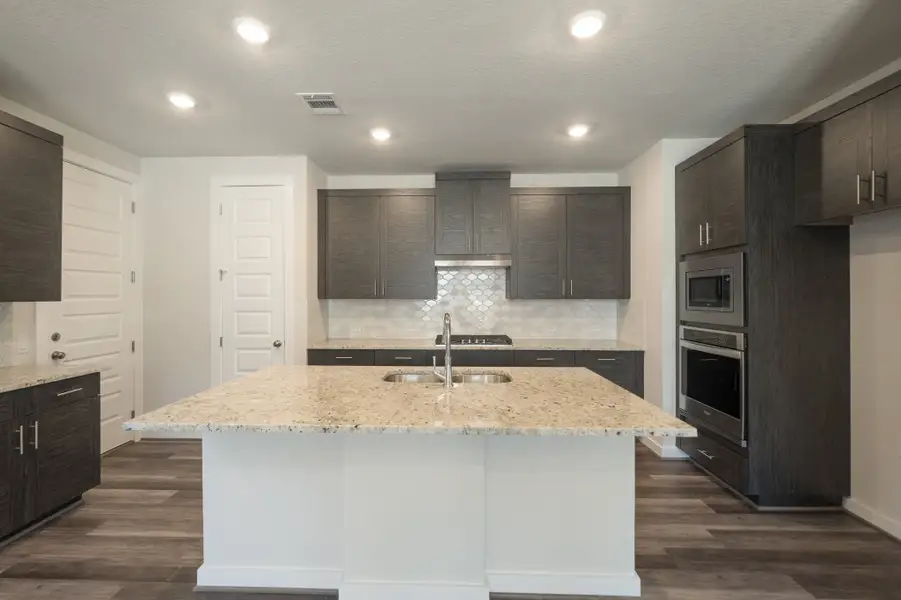 Representative furnished interior of a home built from the Pleasanton by Scott Felder Homes in Flora, Hutto (Image 4).