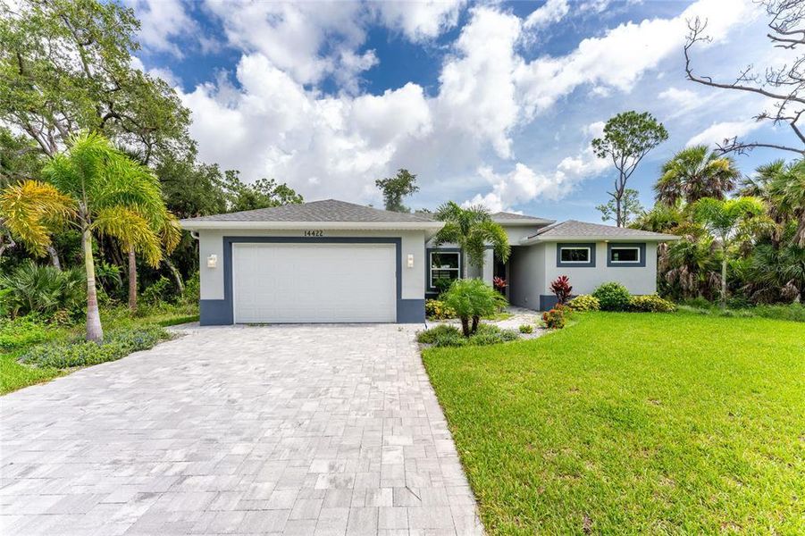 Front exterior of a new home in , Port Charlotte, FL, highlighting curb appeal (Image 2). Front exterior of a new home in , Port Charlotte, FL, highlighting curb appeal (Image 2).