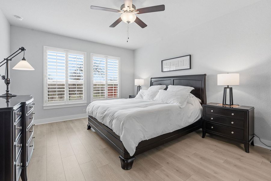 Bedroom featuring light wood-style flooring and a ceiling fan
