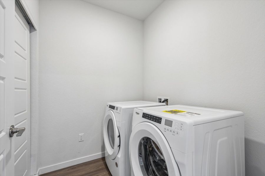 A white washing machine in a room.