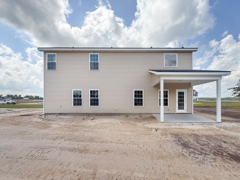 Exterior details and patio area of a home in The Village at Sassafras, Allenhurst (Image 2).