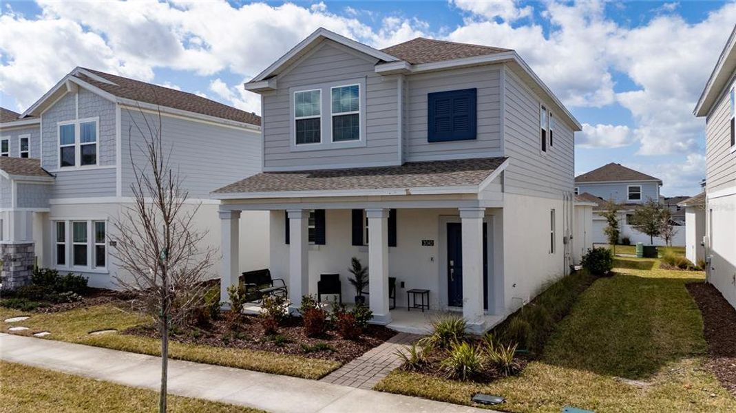 Front exterior of a new home in Bridgewalk, St. Cloud, FL, highlighting curb appeal (Image 2). Front exterior of a new home in Bridgewalk, St. Cloud, FL, highlighting curb appeal (Image 2).