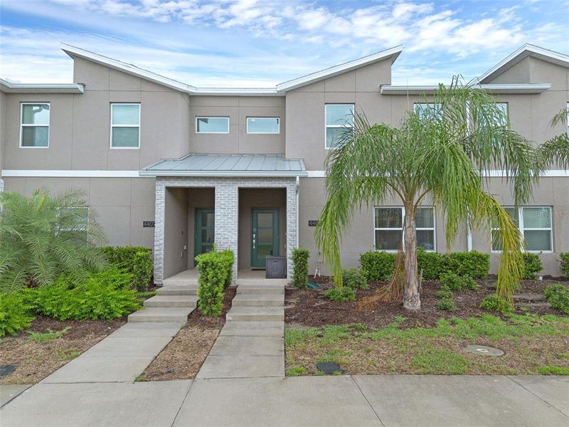 Front exterior of a new home in , Kissimmee, FL, highlighting curb appeal (Image 23).