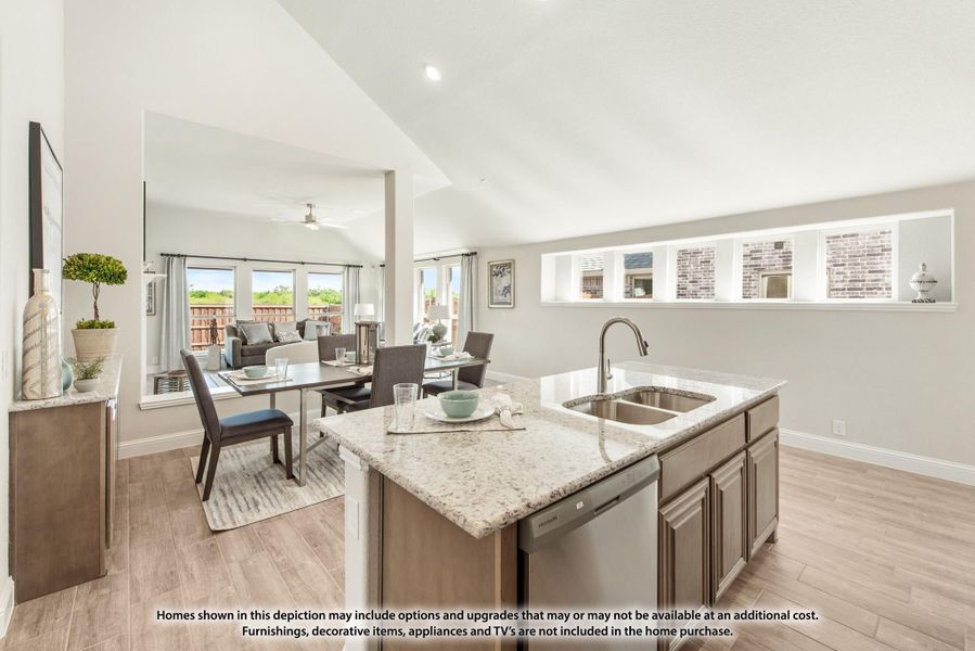 Kitchen island with granite countertop and sink, open to dining and living areas with vaulted ceiling and wood-look floors Kitchen island with granite countertop and sink, open to dining and living areas with vaulted ceiling and wood-look floors